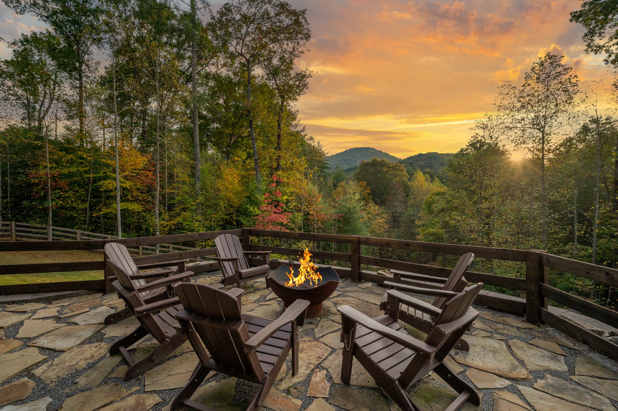 The firepit ringed with Adirondack chairs