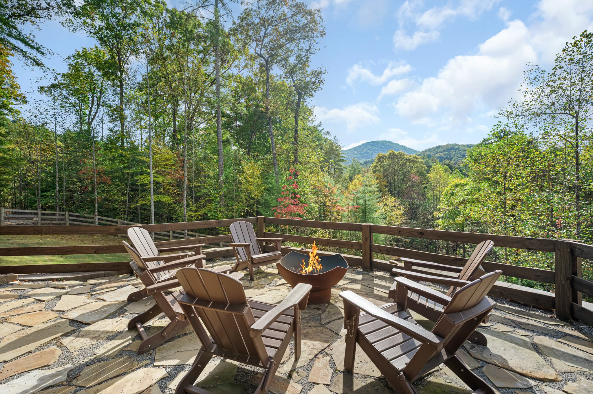 The firepit ringed with Adirondack chairs